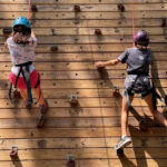 2 kids on the climbing wall