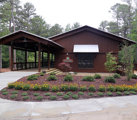 front of the learning center with a large porch and landscaping